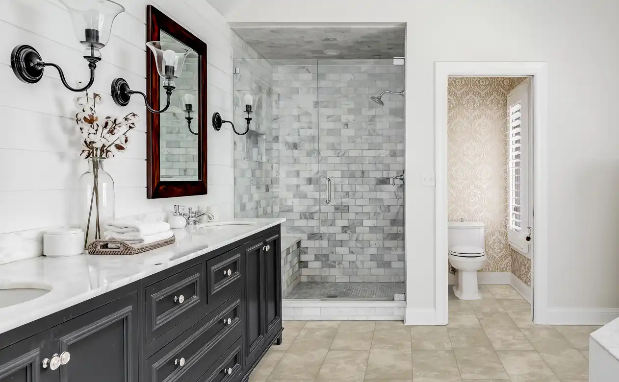 grey and white subway tiled shower with glass door. 