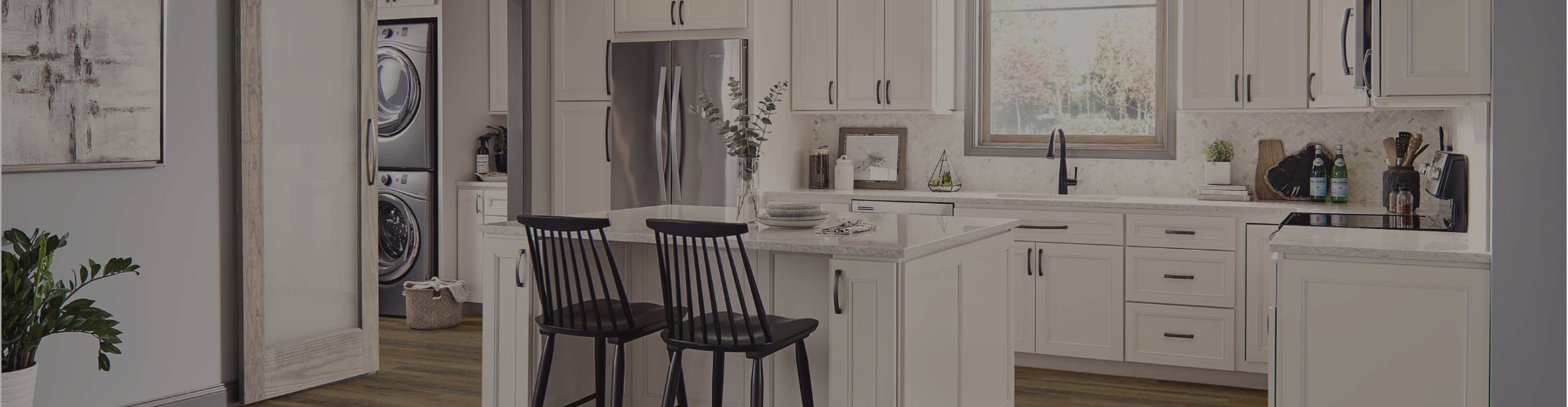wood-look flooring in a kitchen with white cabinetry